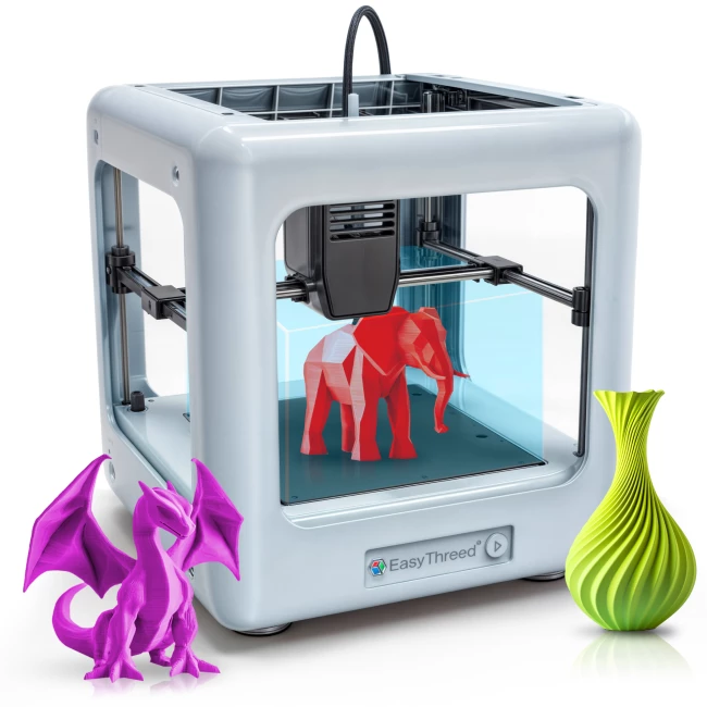 Photo: the school's 3D printer mid-print, with a finished part beside it