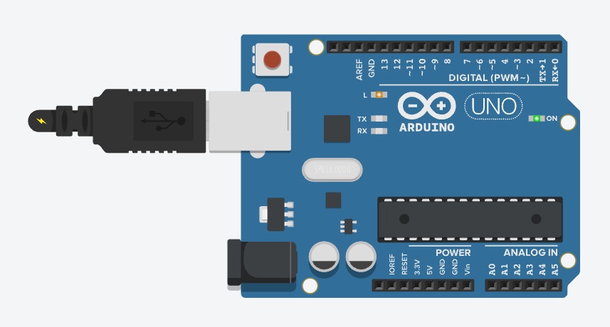 Photo: an Arduino board plugged in by USB with its small orange LED lit
