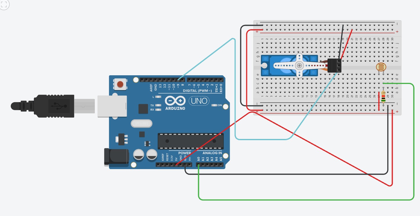 Photo: a light sensor triggering a servo gate to swing open
